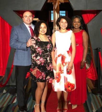 Tania Rogers with her husband and daughters.